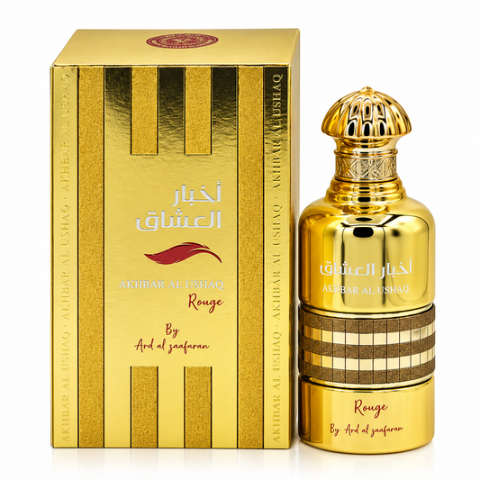 A bottle and box of Akhbar al-Ushshaq Rouge by Arid al Zaafaran, featuring a metallic gold design with brown striped accents and Arabic text on a white background.