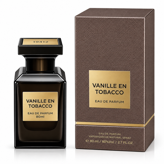 A bottle of Vanille En Tobacco Eau de Parfum next to its textured brown packaging box, both featuring gold labels and a black cap, on a white background.