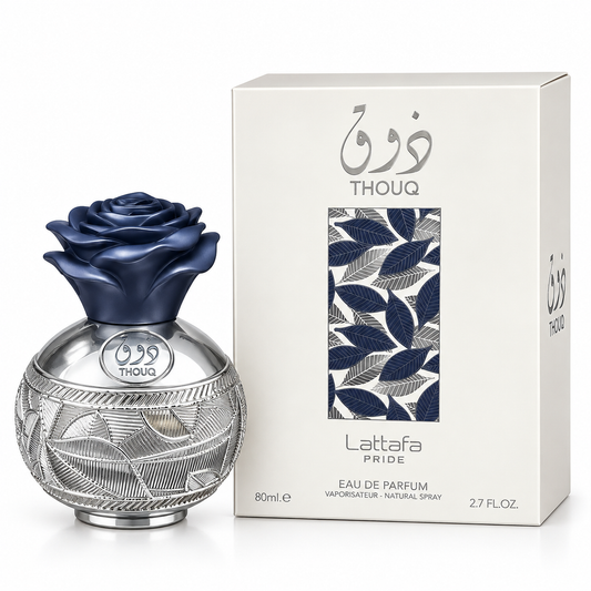 Lattafa Pride Thouq Eau de Parfum bottle with a dark blue rose cap and silver patterned base, shown next to its white packaging box featuring blue leaf patterns and Arabic text.