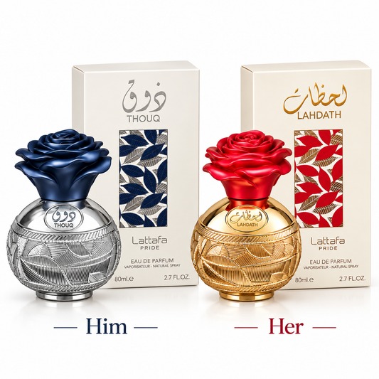 Two perfume bottles and their boxes on a white background, labeled 'Him' and 'Her'. The left bottle is silver with a dark blue rose and the box is cream with blue leaf graphics.