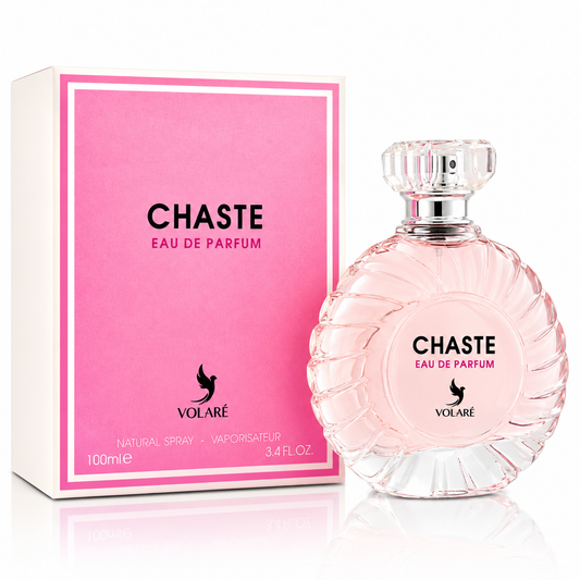 Chaste Eau de Parfum bottle and its pink packaging box by Volaré. The bottle is a clear glass with a scalloped edge and a faceted cap, filled with a pale pink liquid.